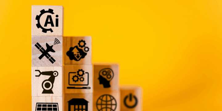 Gestapelde houten blokken met iconen voor AI, technologie en digitale vaardigheden tegen een gele achtergrond, als symbool voor groei en ontwikkeling in toekomstgericht onderwijs.